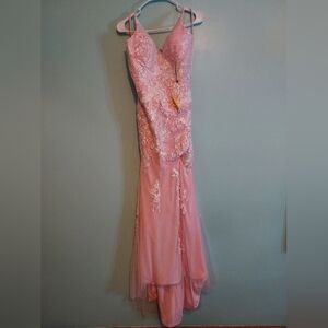 Pink prom dress with criss cross back and floral pattern.